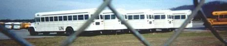 white painted schoolbusses - FEMA camp