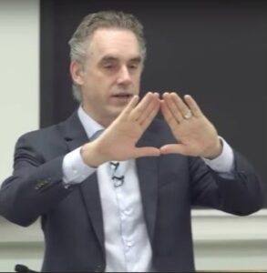 Freemason Jordan Peterson making the triangle - his god is not our God